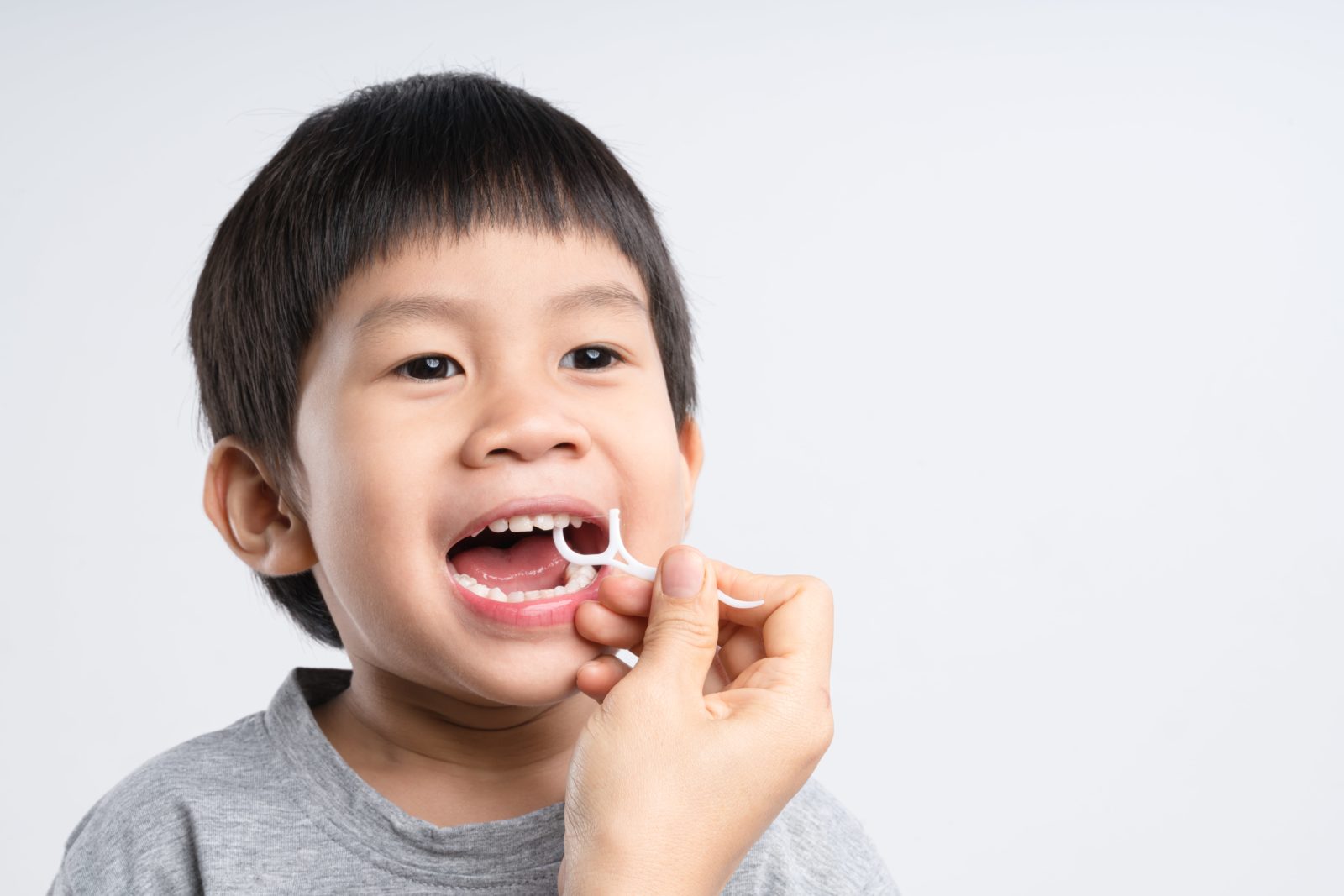 helping child floss