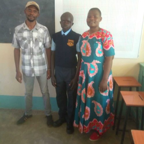 JEVEL accompanied to class at Nyangoma boys secondary school by Foster mother Everline